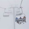 Snowboarders in a Fog