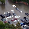 Flooded cars near the Addicks Reservoir are shown as floodwaters from Tropical Storm Harvey rise Tuesday, in Houston