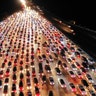 Vehicles are seen jammed on a express way near a toll station in Zhengzhou, Henan province, China, September 24, 2018