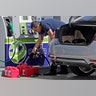 A motorist fills up containers with gas as he prepares for Hurricane Irma, Thursday