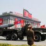 Missiles are driven past the stand with North Korean leader Kim Jong Un during a military parade in Pyongyang, April 15, 2017.