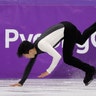 Nathan Chen of the United States falls while performing during the men's figure skating short program at the 2018 Winter Olympics