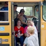 School staff members sit in a school bus after a shooting at the Santa Fe High School in Santa Fe, Texas, May 18, 2018