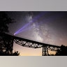 A person holds a flashlight up to night sky as Perseid meteors streak across the sky in Esme district of Usak, Turkey,  August 14, 2018