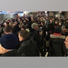 Commuters exit the New York Port Authority after an explosion in New York City, Monday