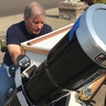 Amateur astronomer Mike Conley practices with the telescope he will use to document the total solar eclipse, at his home in Salem, Oregon