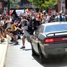 A vehicle drives into a group of protesters demonstrating against a white nationalist rally in Charlottesville, Va., August 12