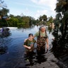 Kelly McClenthen returns to see the flood damage to her home with Daniel Harrison in the after Hurricane Irma in Bonita Springs, Fla., Monday