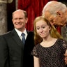 Vice President Joe Biden talks to Maggie Coons, next to her father Sen. Chris Coons in Washington, January 6, 2015