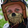 A participant poses during a motorbike race at the women-only Petrolettes motorcycle festival in Neuhardenberg, Germany