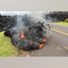 Lava from the Kilauea volcano moves across the road in the Leilani Estates in Pahoa, Hawaii, May 5, 2018