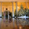Christmas decor adorns Grand Foyer of the White House in Washington.