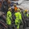 Emergency personnel rescue a 14-year-old girl from a house after a mudslide in Montecito, California, January 9, 2018
