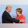 President Donald Trump greets German Chancellor Angela Merkel on the first day of the G-20 summit in Hamburg, Germany