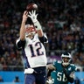New England Patriots quarterback Tom Brady can't catch a pass on a flea flicker during the first half of Super Bowl 52 in Minneapolis