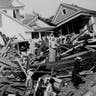 People rummage through rubble of destroyed houses following a hurricane which devastated most of Galveston and took more than 5,000 lives