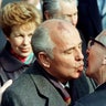 Soviet Leader Mikhail Gorbachev is welcomed by East German Leader Erich Honecker with a fraternal kiss in East Berlin, October 6, 1989