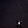 Perseids meteors cross the night sky over a Catholic church in the village of Vowchyn, Belarus, August 12, 2018