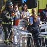 People are helped after a van crashed into a crowd of residents and tourists on Las Ramblas in Barcelona, August 17