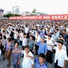 People participate in a Pyongyang city mass rally held at Kim Il Sung Square, August 9
