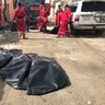 Body bags with the human remains of some of the victims who were handcuffed and blindfolded, killed by a bullet to the back of the head