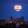 The moon rises above Whitby Abbey in Whitby, north east England, December 3