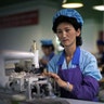 Kim Hyon Ae, 41, a seamstress at a shoe factory in Wonsan, poses for a portrait in Wonsan, North Korea, June 22, 2016