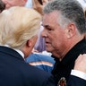 President Donald Trump, talks with Rep. Peter King, R-N.Y., during the Congressional Picnic at the White House
