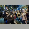 Heavily armed police guard participants in the annual Halloween Parade following a terror attack in New York City, October 31