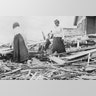 Two women search through rubble following a violent hurricane which devastated most of Galveston and took more than 5,000 lives