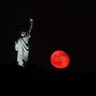 Lady Liberty and the rising moon on Sunday