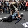 Counter demonstrators attack a white supremacist during a rally in Charlottesville, Virginia, U.S., August 12