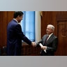 U.S. Attorney General Jeff Sessions shakes hands with FBI Director James Comey at the Justice Department, February 9, 2017