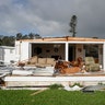 A trailer home with a front ripped off by Hurricane Irma winds is seen near Naples, Florida, Monday