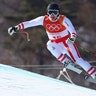 Austria's Matthias Mayer competes on his way to winning the gold medal in the men's super-G at the 2018 Winter Olympics 