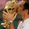 Switzerland's Roger Federer kisses the trophy after defeating Croatia's Marin Cilic to win the Wimbledon men's singles title