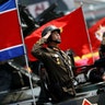 A soldier salutes from atop an armored vehicle during a military parade in Pyongyang April 15, 2017