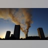 Smoke billows from the apartment building on fire in West London