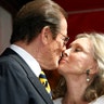 Moore kisses his wife Kristina during ceremonies unveiling his star on the Hollywood Walk of Fame on October 11, 2007