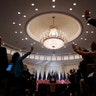 Reporters raise their hands to ask a question as President Donald Trump speaks during a news conference in New York, September 26, 2018