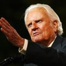 Evangelist Billy Graham speaks to thousands of people during his New York Crusade at Flushing Meadows Park in New York June 24, 2005