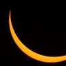 The moon passes in front of the sun during the partial phase of a total eclipse near Useful, Missouri