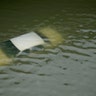 A car is submerged on a freeway flooded by Tropical Storm Harvey on Sunday, near downtown Houston