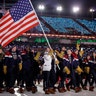 Erin Hamlin carries the flag of the United States during the opening ceremony of the 2018 Winter Olympics in Pyeongchang