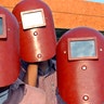 Indian students use welders masks to view the annular solar eclipse over the southern Indian city of Chennai, October 3, 2005