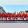People participate in a mass rally held at Kim Il Sung Square in Pyongyang, August 9