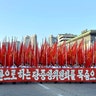 People participate in a mass rally held at Kim Il Sung Square in Pyongyang, August 9