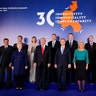 President Donald Trump and Polish President Andrzej Duda take part in a family photo at the Three Seas Initiative Summit in Warsaw