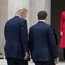 French President Emmanuel Macron and President Donald Trump walk to their wives Melania Trump and Brigitte Macron at Les Invalides 