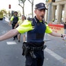 A police officer after a van crashed into a crowd of residents and tourists on Las Ramblas in Barcelona, August 17